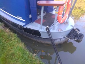 Stern of boat set out from bank